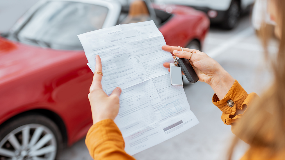 Lady with orange top holding up a document and car keys with a red car in background.