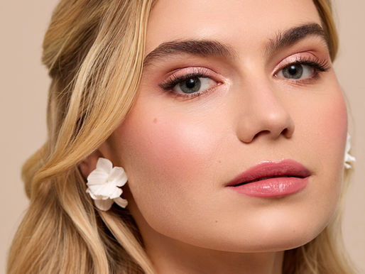 Close-up of natural bridal makeup with soft glowing skin and elegant wedding hair styling