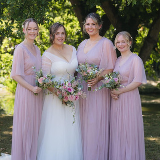 Bride with smooth, shiny curls and understated soft glam makeup in Surrey