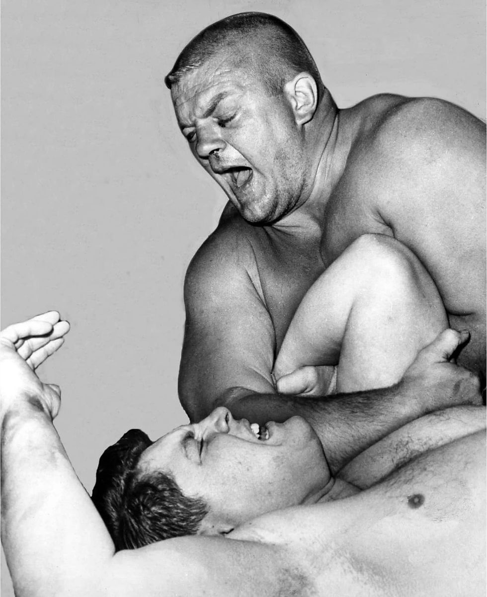 Dick the Bruiser showing Alex Karras what the wrestling business looks like