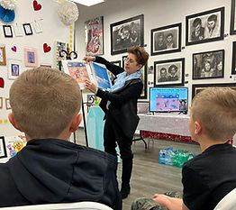 Dr. Howlett is reading aloud at Art DeCentrale Art Gallery 