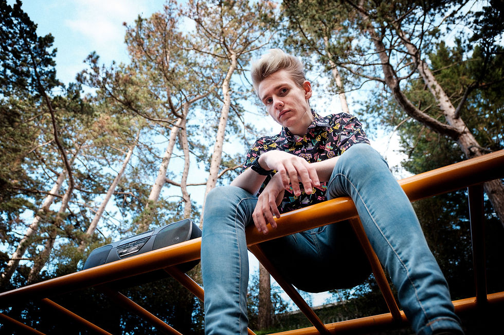 man with boom box and vintage bus seat shirt on monkey bars for vintage Superdry advert.