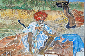 A camel rider taking a respite. mending quilt