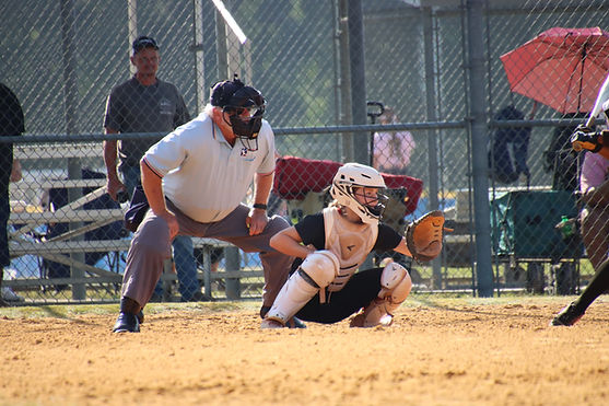 Softball player with umpire