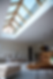 Vertical view of large kitchen diner with oak island and oak lantern rooflight