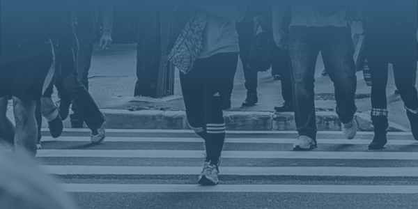 pedestrians walking across crosswalk