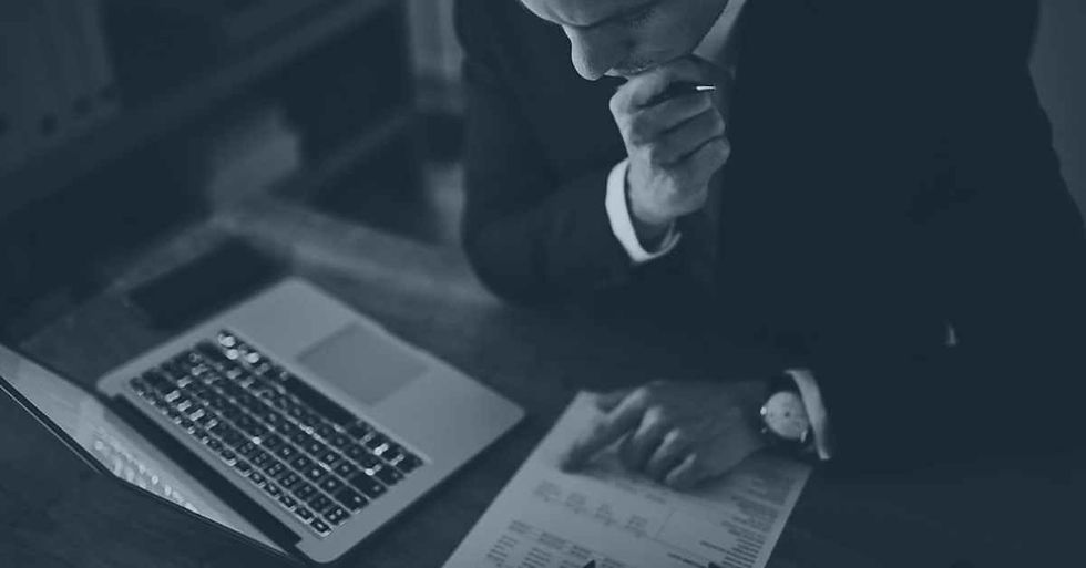 man looking at inheritance tax on form