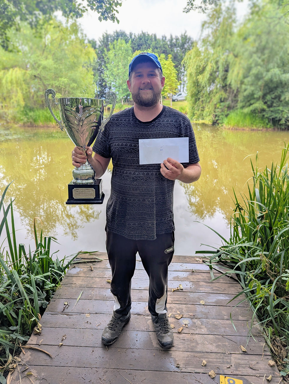 The 2025 Midland Air Ambulance Champion, Lawrence 'Loz' Connolly, with the impressive winners trophy