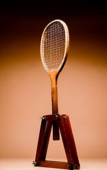 Profile view of a child‑size lawn tennis racquet, oriented to the right