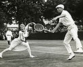 Old picture showing Lacoste and Suzanne Lenglen playing tennis