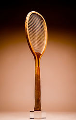 Full profile view of a Slazenger Renshaw lawn tennis racquet from 1899, oriented to the left