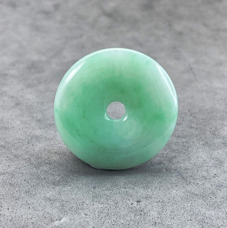 One hand polished natural color jadeite donut, green jade donut, well