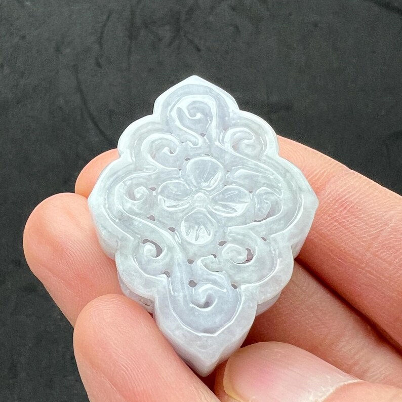 Hand carved jade charm: Lavender jade, flowers, a symbol of transformation