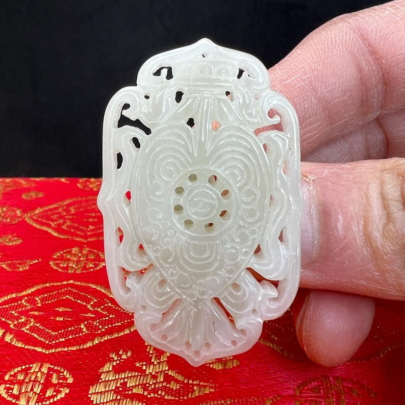 White jade carving: One(1) hand carved white jade pendant of buddhism