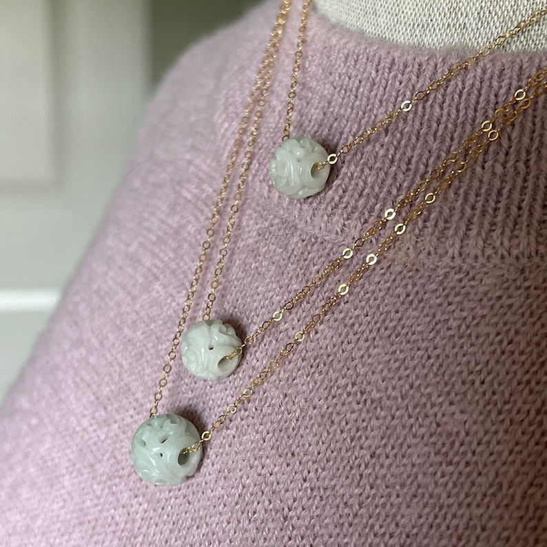 Jade Necklace: 1 round hand carved natural color jadeite bead, carved with
