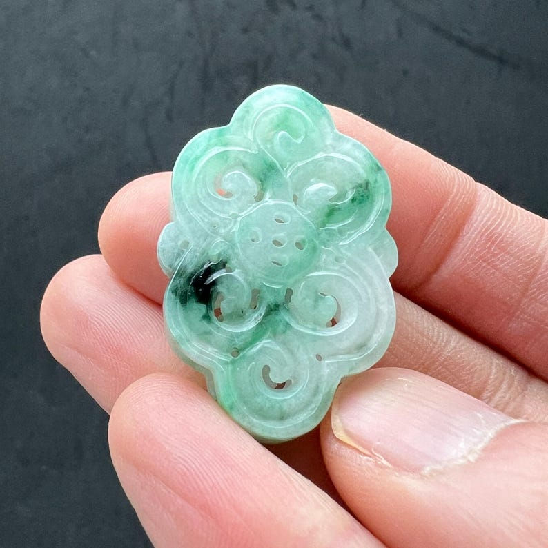 Hand carved jade charm: Lavender jade, flowers, a symbol of transformation