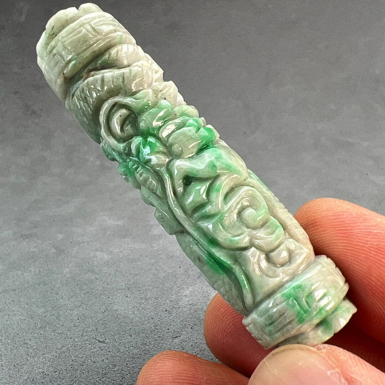 Jade carving: One(1)hand carved natural color jade tube bead, carved with