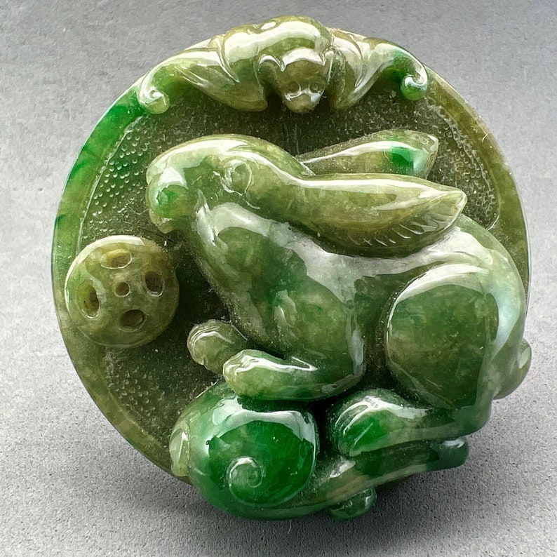 Jade carving: One(1) hand carved jadeite pendant of a rabbit, year of the