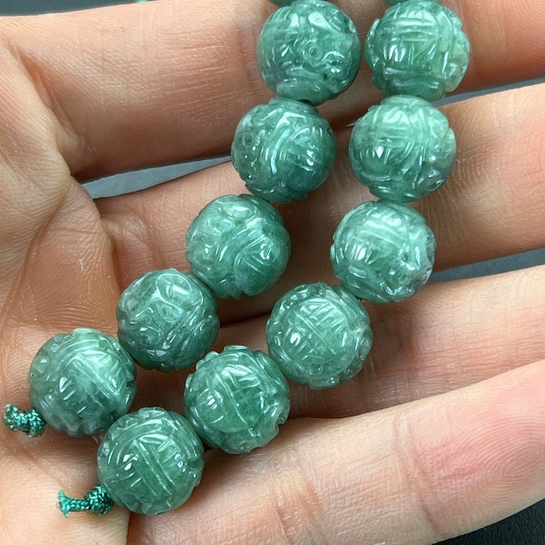 Jade carving: one hand carved natural color jadeite bead, carved with