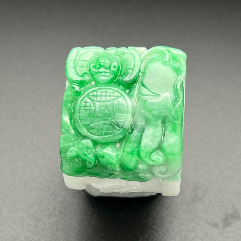 Jadeite ring carved with bats and buddha's hand, natural color fei cui
