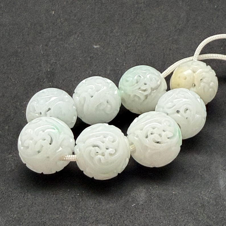 Stone of Heaven : One hand carved natural white color jadeite bead, carved