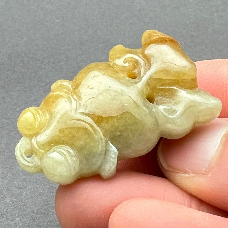 Jadeite carving: One natural jade carving of a koi fish, natural color jade