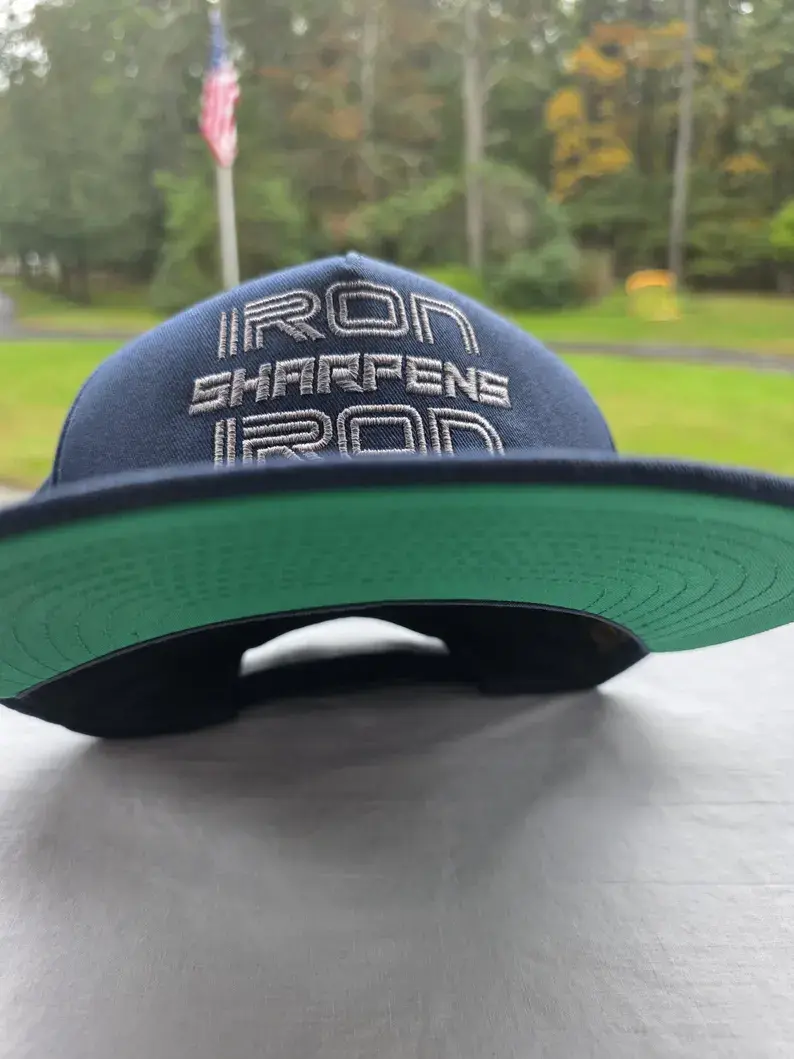Thumbnail: IRON SHARPENS IRON CAP