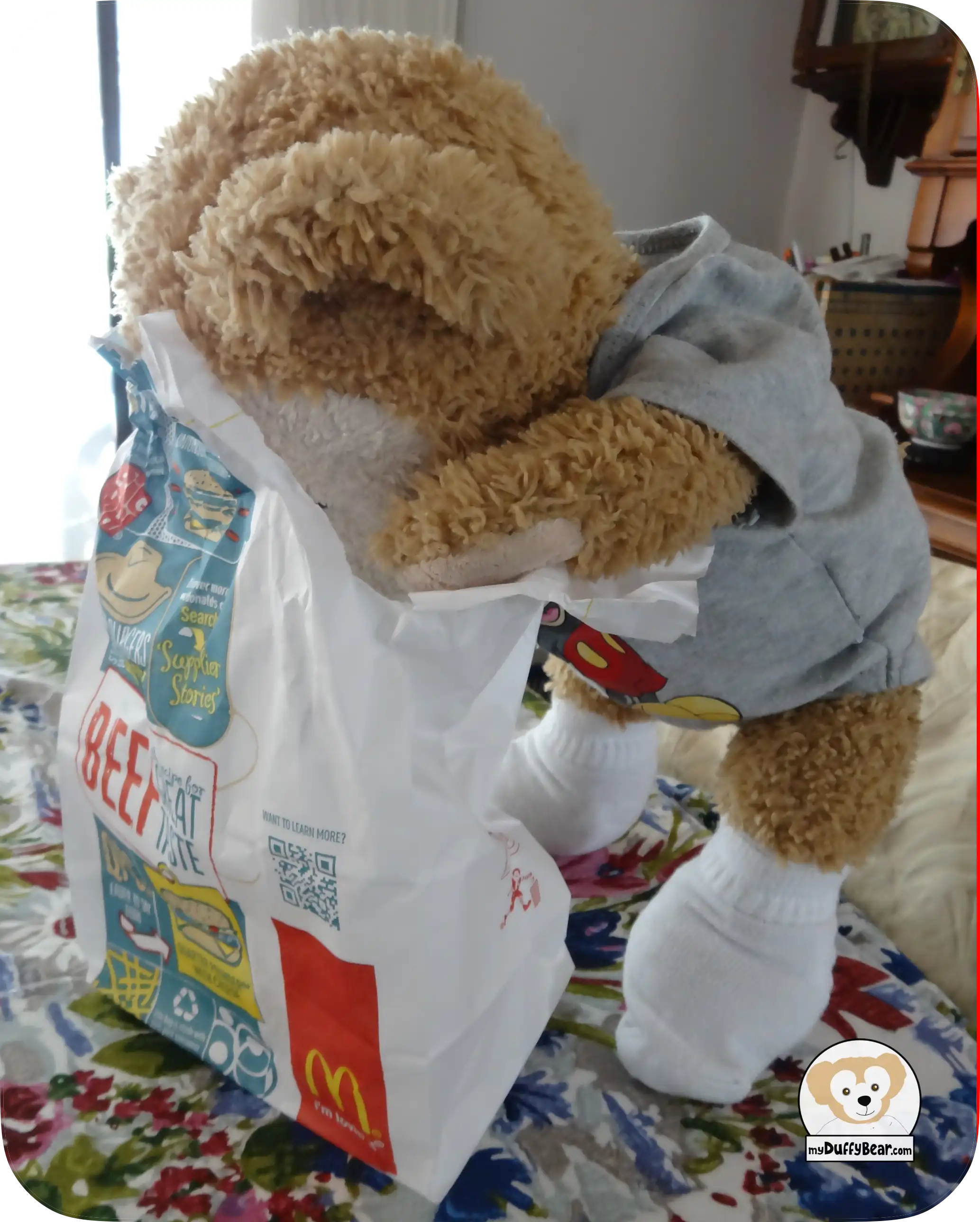 Duffy's face is hidden in the McDonalds bag as he looks for his super sized french fries