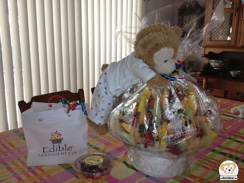 Duffy jumped up and gave a big hug to the Edible Arrangement