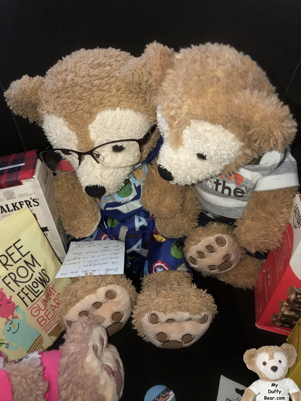 Duffy, wearing his reading glasses, carefully studies the note with Little Joe leaning over his shoulder