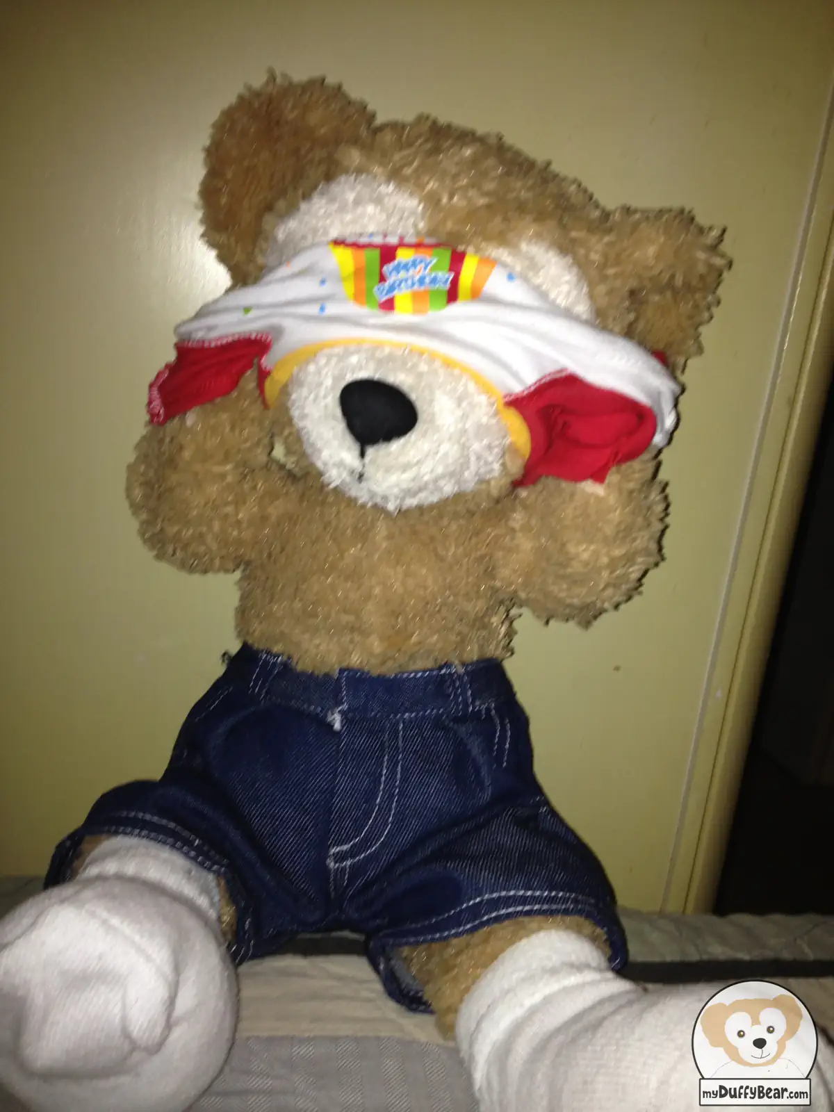 Duffy the Disney Bear's tee shirt gets stuck on his head