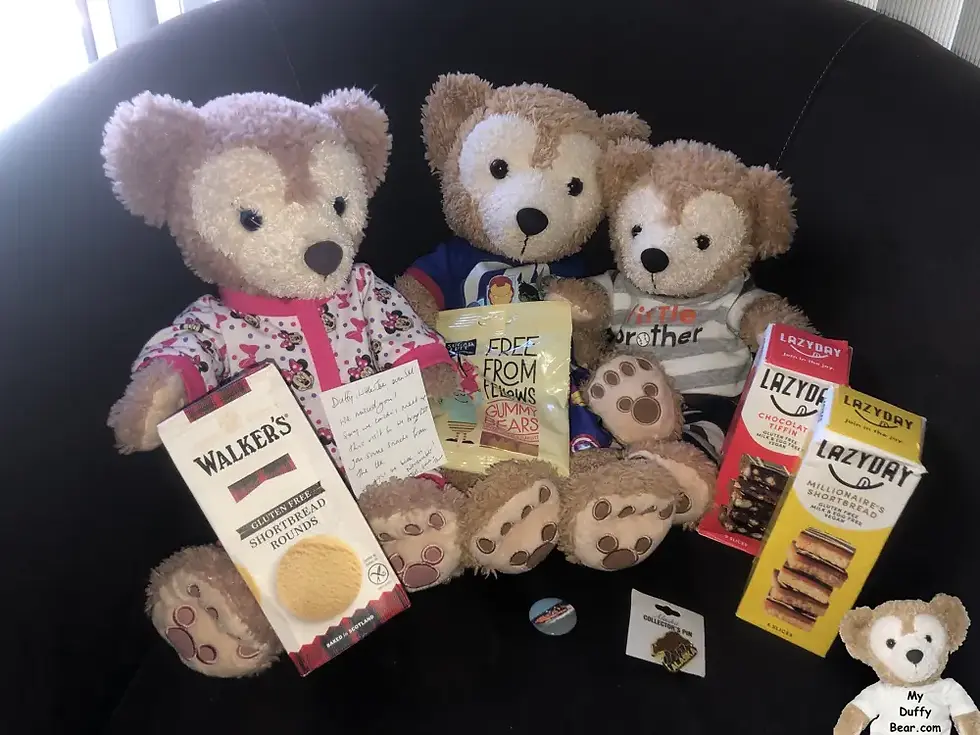 Duffy, ShellieMay and Little Joe pose with the treats and gifts.