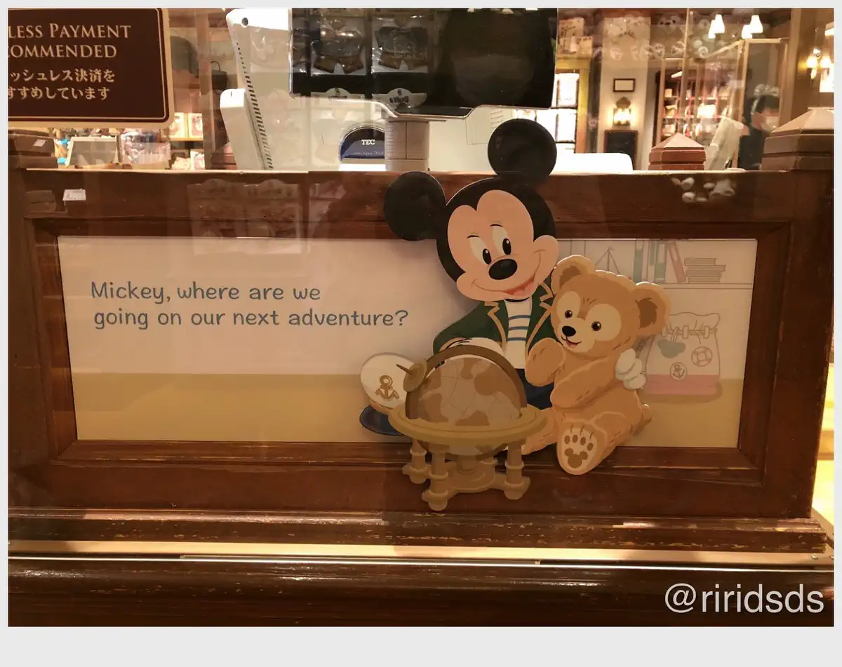 Mickey and Duffy sit in front of a world globe
