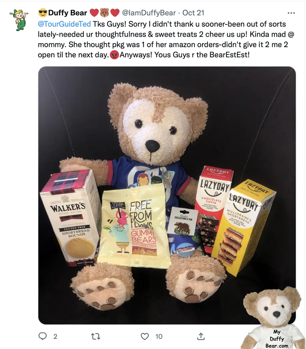 Duffy poses with all the gifts and treats from TourGuideTed