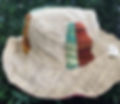 reversible natural hemp hat with patchwork accents of blue tones and orange tones. 