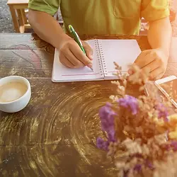 Woman journaling during Sacred Self Care Summit by Profound Wellness