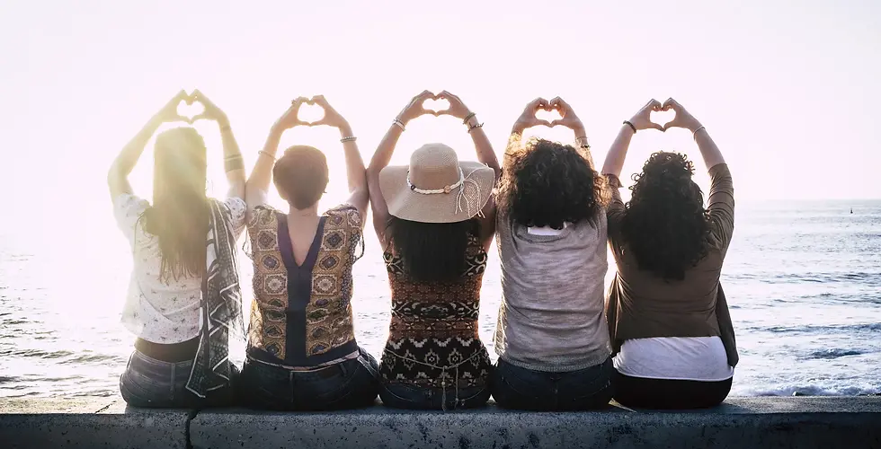 Women sitting together, raising hands, expressing joy from Bold, Beautiful Life Membership