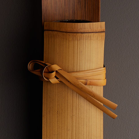 Folded bamboo wall vase by Iizuka Rokansai
