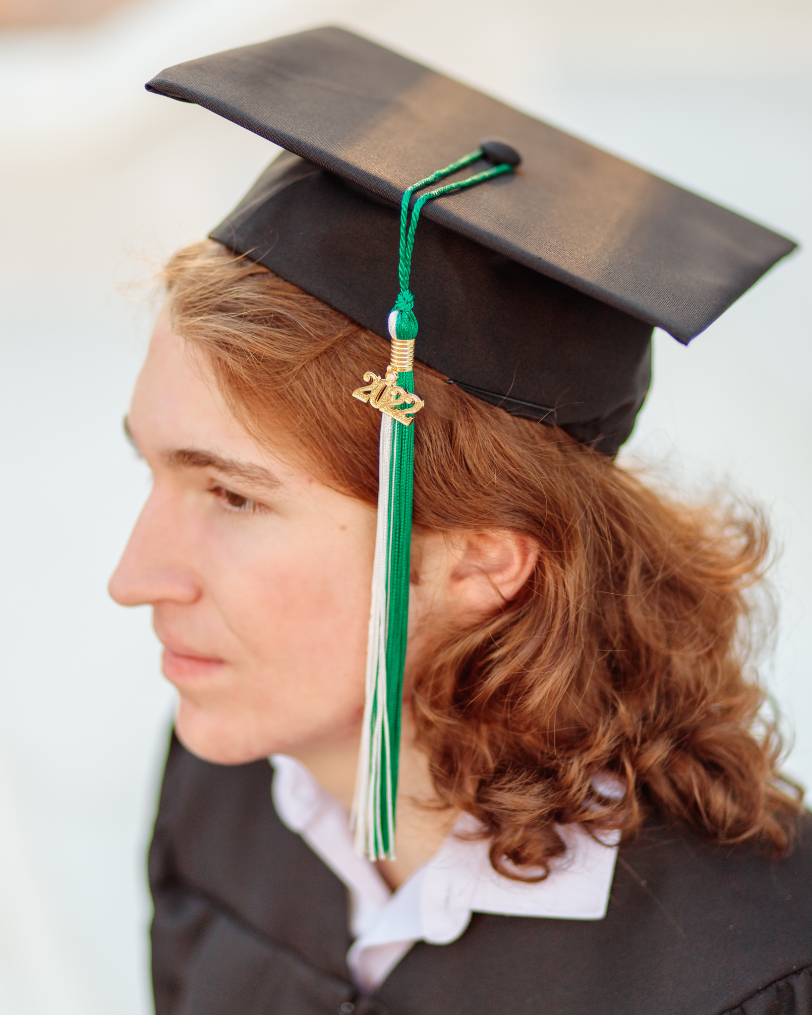 Senior boy session graduating senior photos downtown Naples, FL Photographer tassel photo