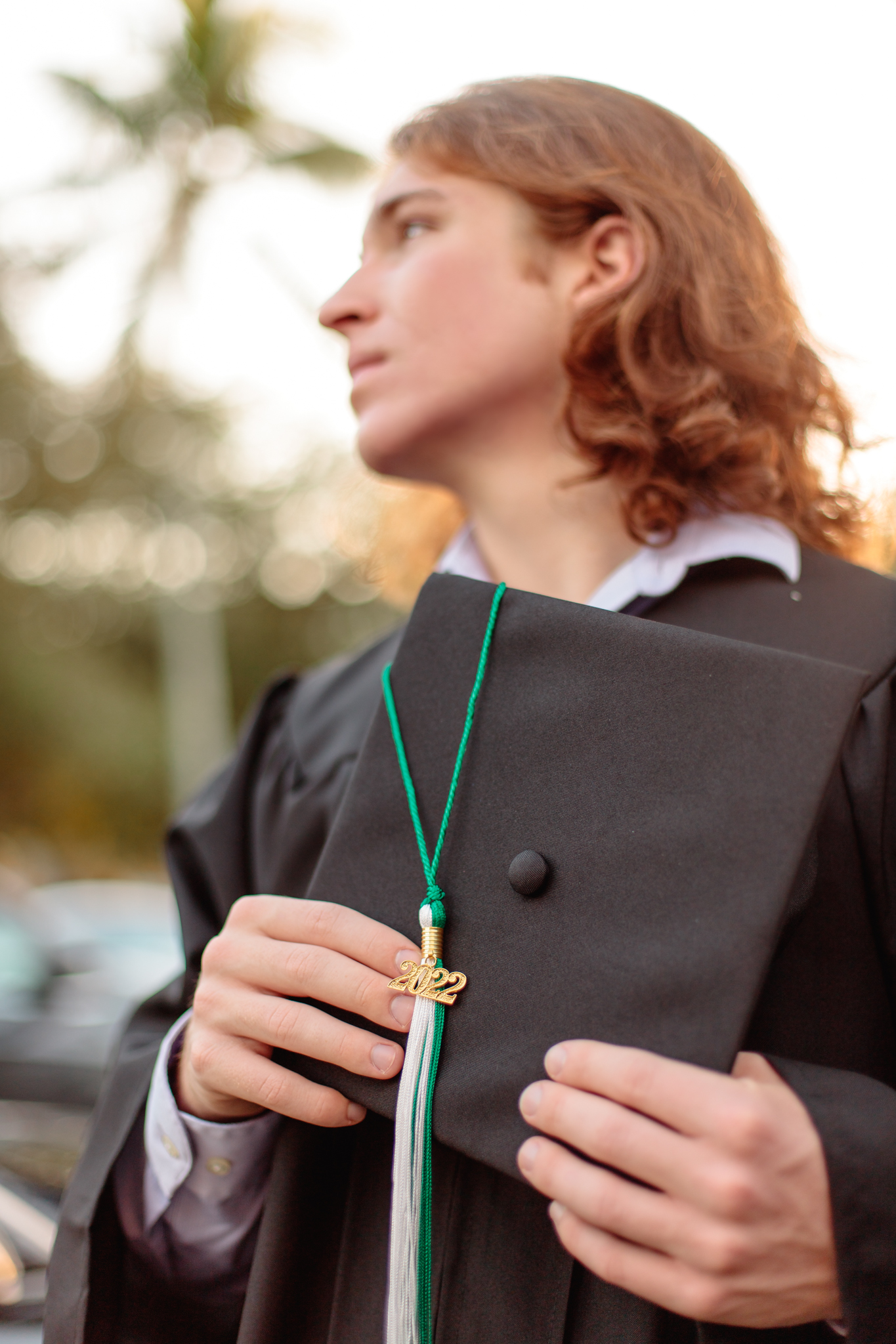 Senior boy session graduating senior photos downtown Naples, FL Photographer Cap and gown