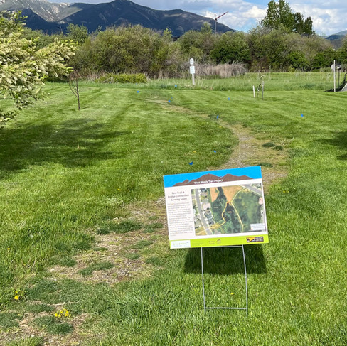 BEFORE Trail Improvement with Project Sign in West Winds