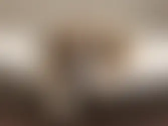 grieving dog lying on a padded bed