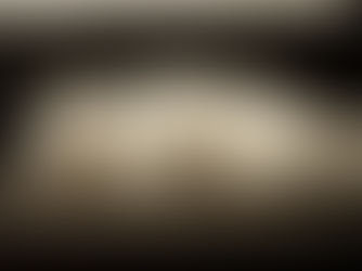 white cat sleeping on black table