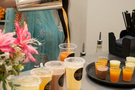 Wedding guests enjoying personalised mocktails from a luxury mobile mocktail bar