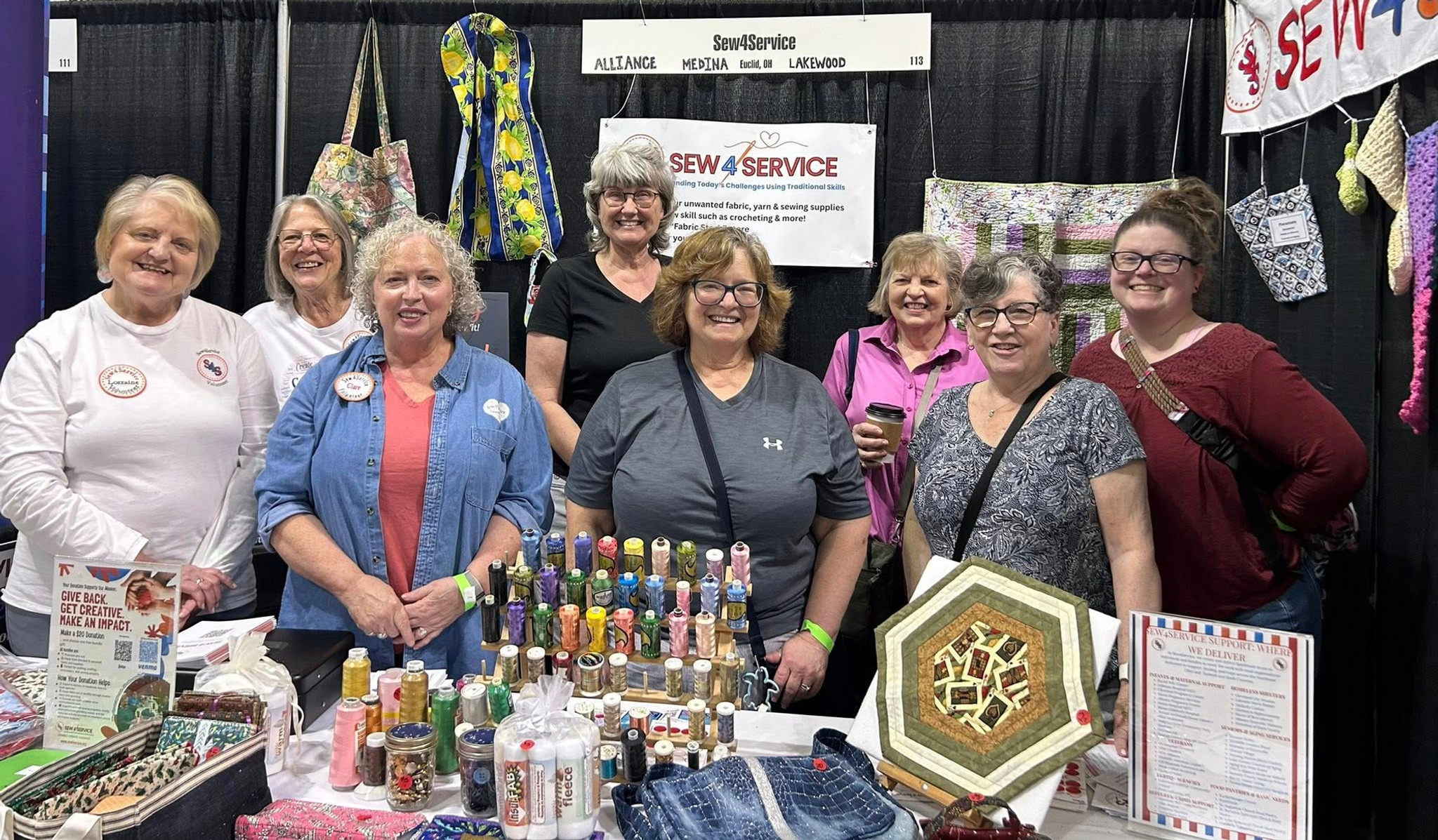 Volunteers Helping at our booth during the Quilt Expo