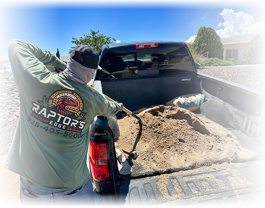 Raptors Edge crew member unloading decorative rock for a residential landscape installation