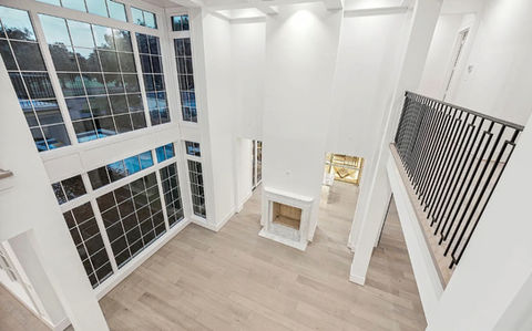 Hardwood flooring installation at Liam Residence in Houston-Katy-Cypress-Tomball-The Woodland-Fulshear TX, warm engineered wood floors on first and second level, professionally installed by Bager LLC for Houston families seeking durable, elegant hardwood flooring. 