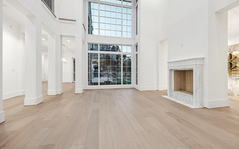 Installation of wide-plank luxury vinyl plank (LVP) flooring in a modern home in Katy, Houston, Cypress, Tomball, and The Woodlands, Texas. Durable and stylish flooring solutions.