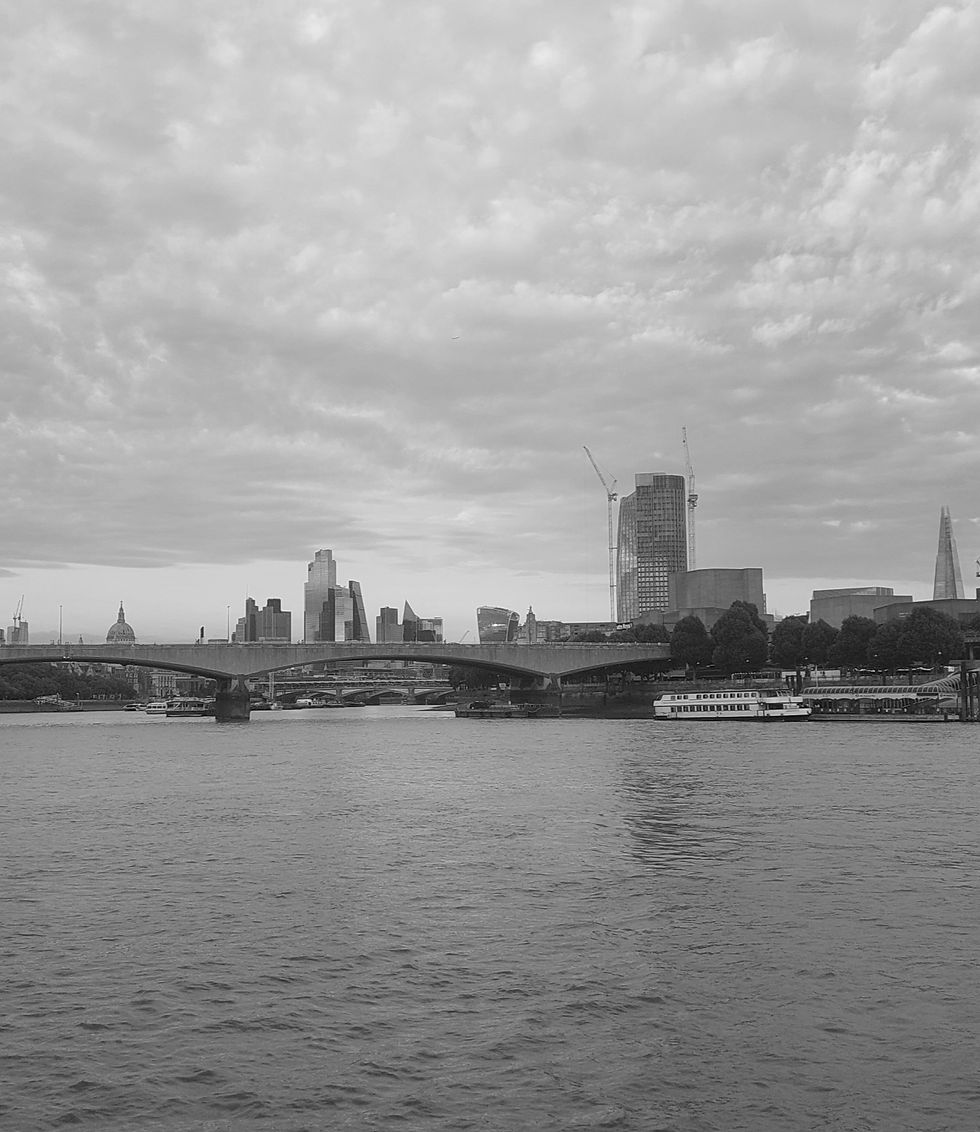 Urban riverside view – representing calm, reflection, and space to think in a busy business world.
