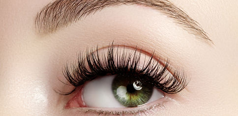 Close-up of eye showing lash and brow treatment